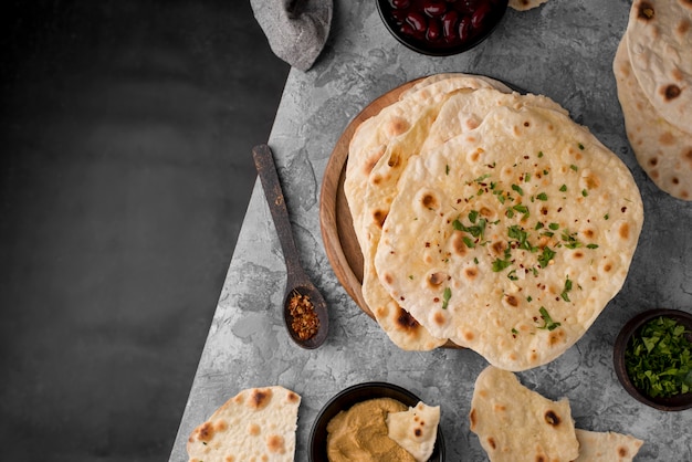 Free photo delicious roti assortment on the table with copy space