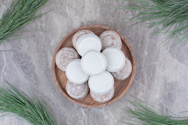 Free Photo delicious round biscuits on wooden plate.