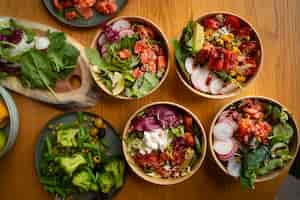 Free photo delicious salmon bowls on table arrangement