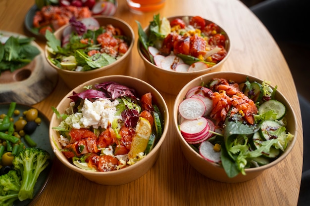 Delicious salmon bowls on table arrangement