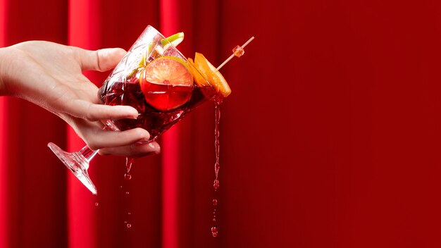 Delicious sangria cocktail held in hand