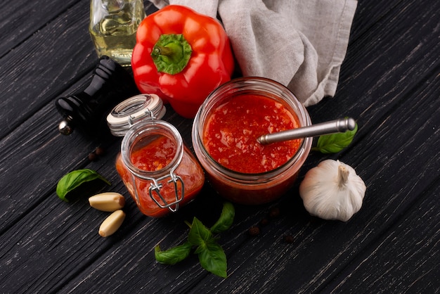 Free photo delicious sauce on wooden table high angle