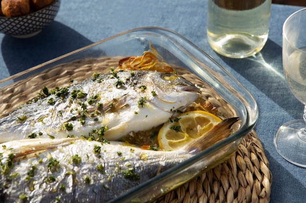 Delicious seabream with lemons high angle