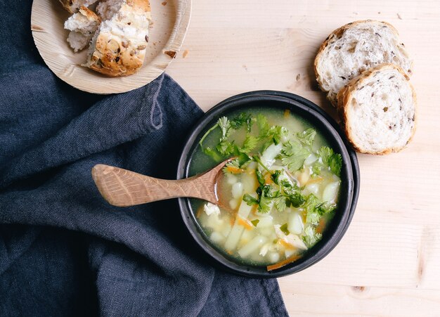 Delicious soup on black bowl