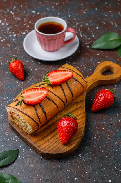 Free photo delicious strawberry cake roll with fresh strawberries,top view