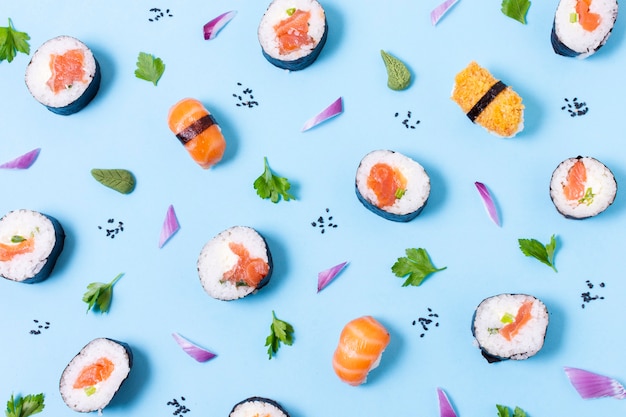 Delicious sushi rolls on table