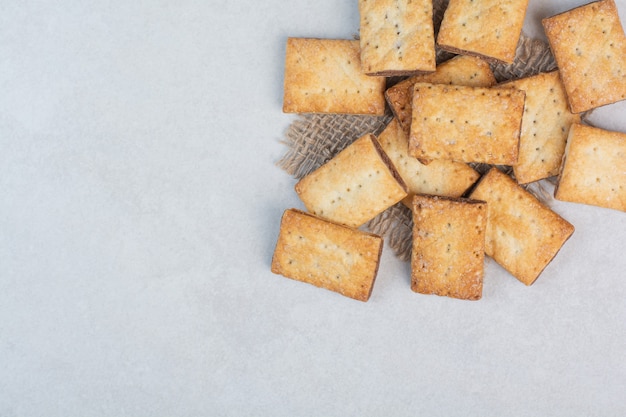 Free Photo delicious sweet crackers on sackcloth on white background. high quality photo