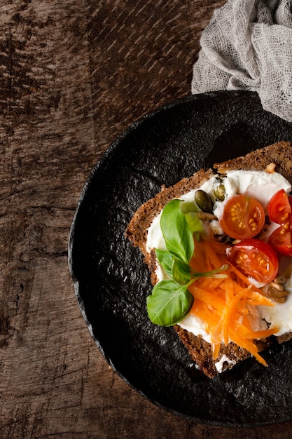 Delicious toast slice with cherry tomatoes on pan