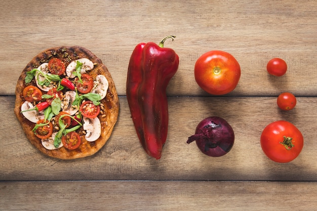 Delicious veggie food on wooden background