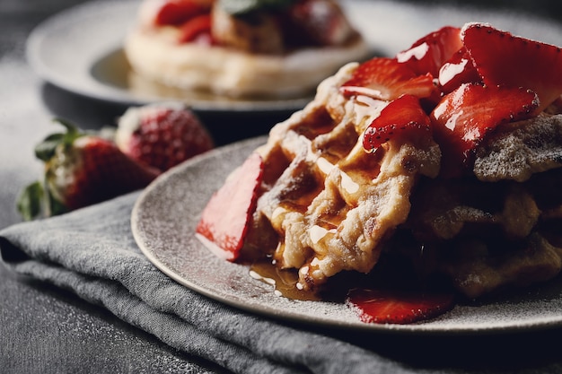 Delicious waffles with fruit and honey