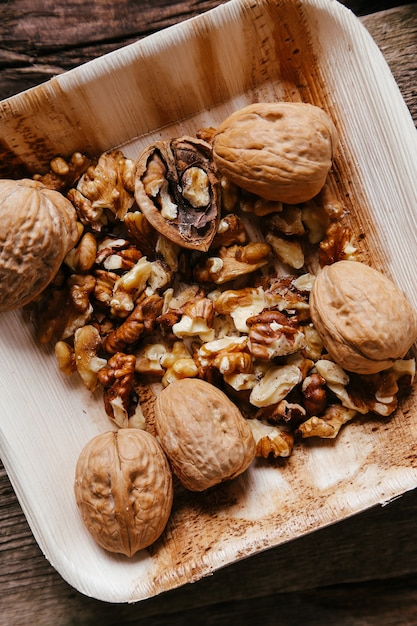 Free Photo delicious walnuts on wooden bowl