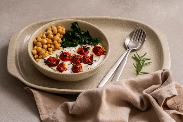 Delicious yougurt meal with chickpeas and dried tomatoes