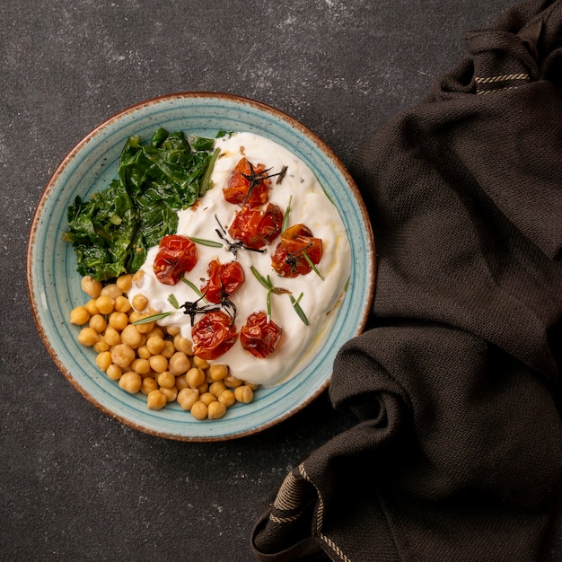 Delicious yougurt meal with chickpeas and dried tomatoes