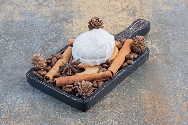 Delicious zephyr with coffee beans and pinecones. High quality photo