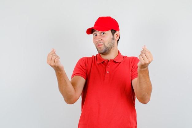 Delivery man in red t-shirt, cap making korean love sign