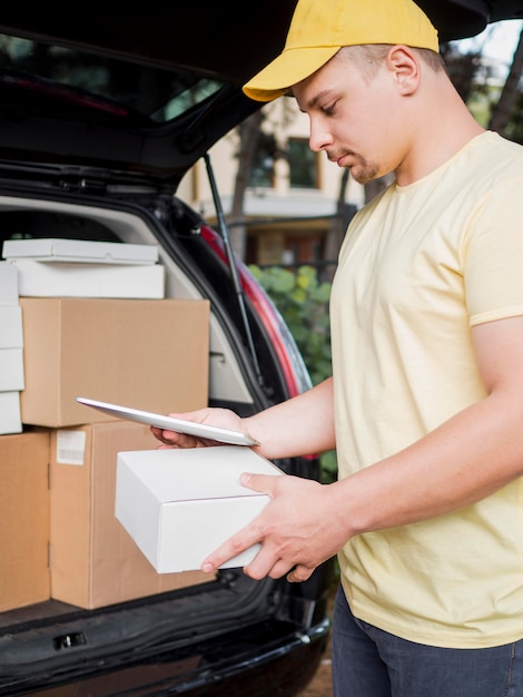 Delivery man wearing yellow cap