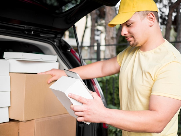 Delivery man with device and box