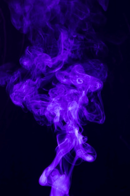 Free Photo dense smoke swirling around against a black background