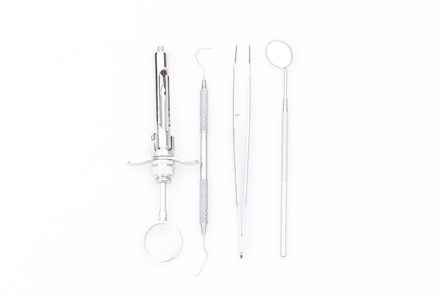 Dental tools and equipment on white background