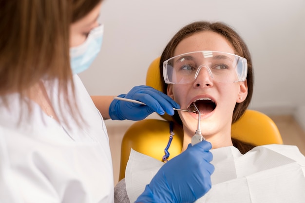 Free photo dentist checking patient mounth care