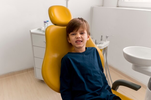 Dentist cleaning child's teeth