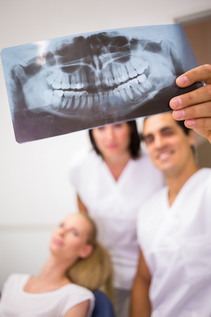 Free photo dentists discussing over dental x-ray report