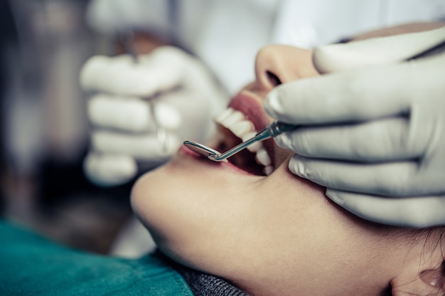 Dentists treat patients' teeth.