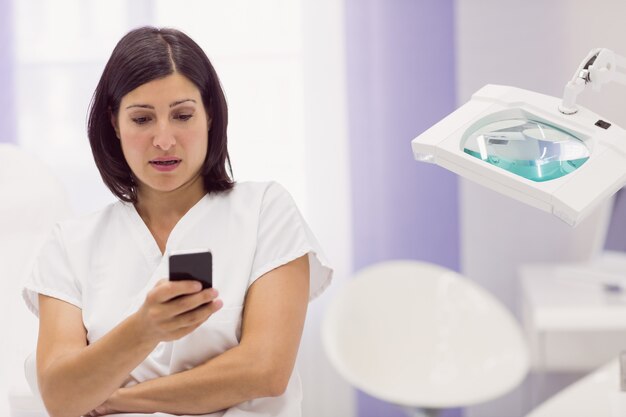 Dermatologist using mobile phone