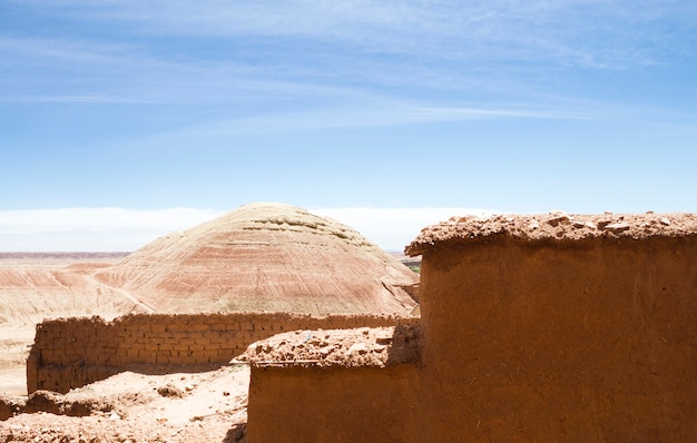 Free Photo desert landscape with ruins under blue sky