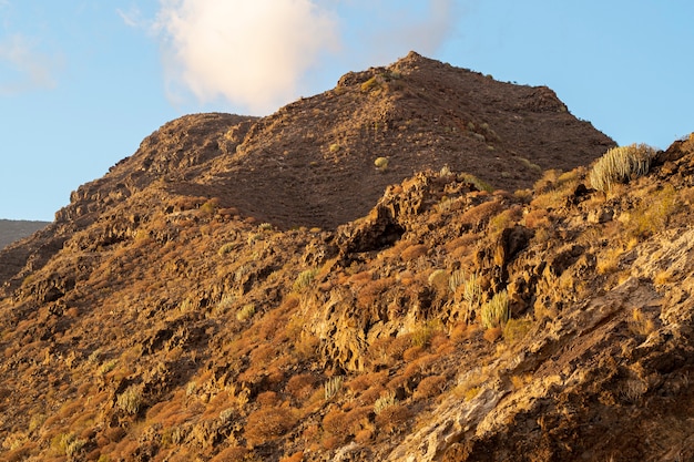 Desert mountain peak with cloudy sky