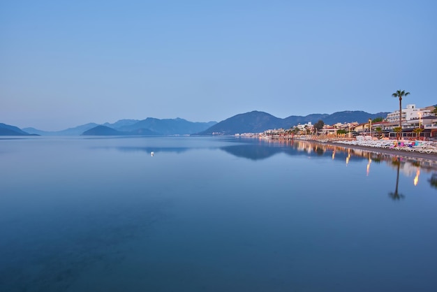 Deserted beach in the morning sun The beach at dawn Empty sunbeds Beach without people Marmaris