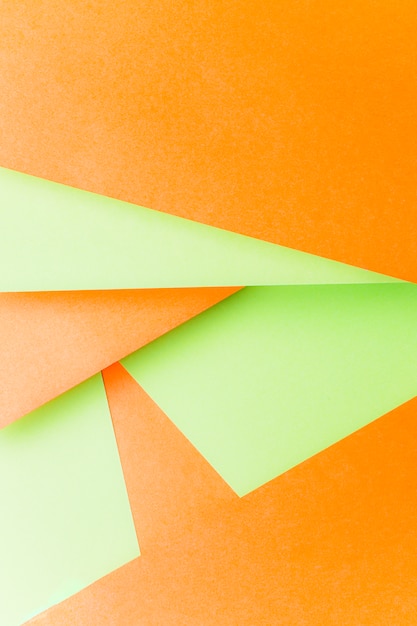 Free Photo design made with green and an orange paper background