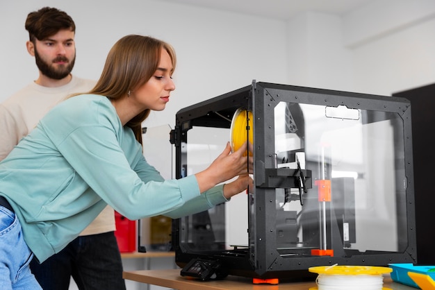 Free Photo designers using a 3d printer