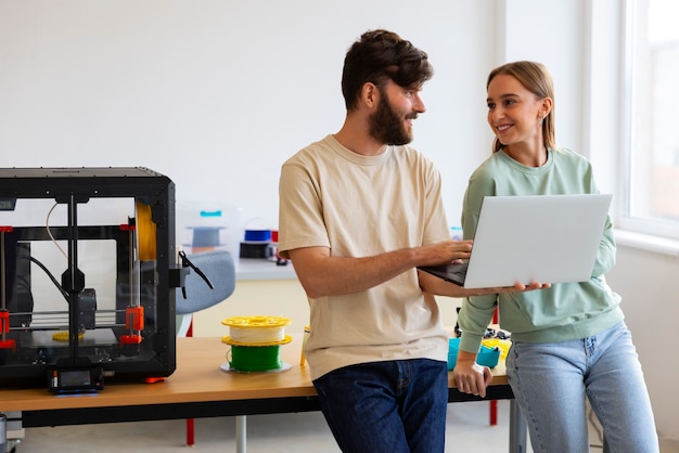 Free Photo designers using a 3d printer