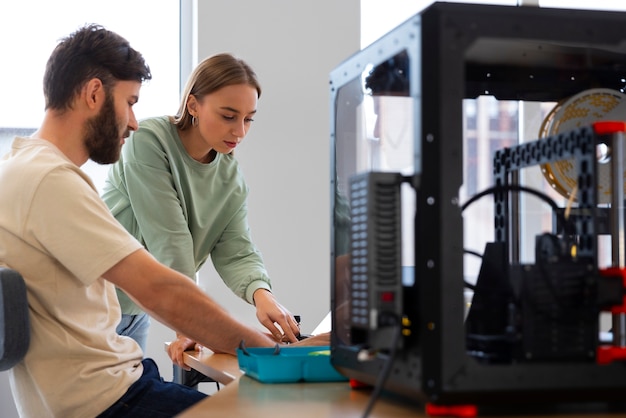 Free Photo designers using a 3d printer