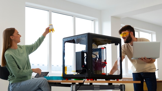 Free Photo designers using a 3d printer