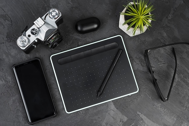 Free photo desk arrangement on slate background top view