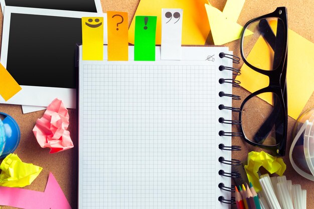 Desk of an artist with lots of stationery objects