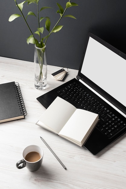 Free Photo desk assortment with laptop and notebooks