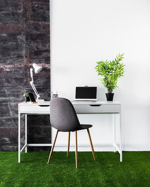 Free photo desk concept with white laptop