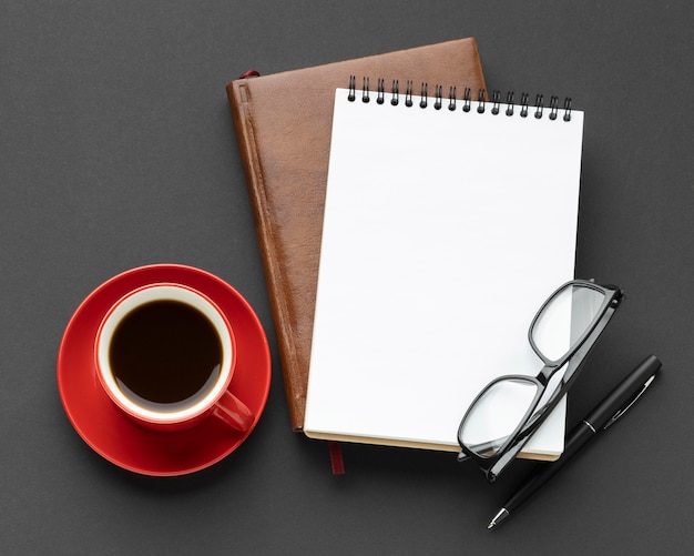 Desk elements arrangement with cup of coffee