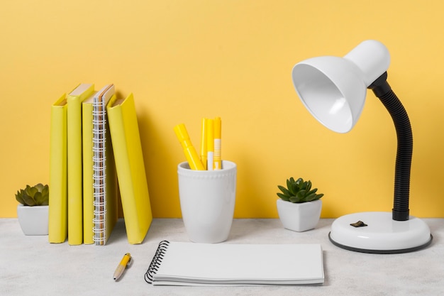 Desk lamp and notebook arrangement