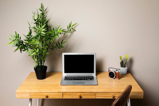 Desk with gray laptop and chair