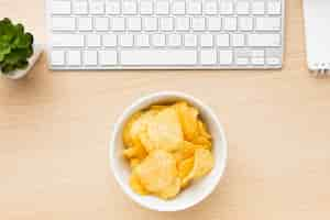 Free photo desk with potato chips bowl