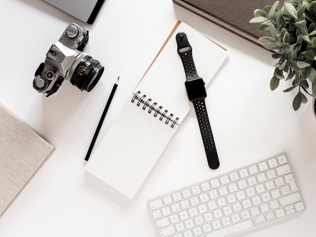 Desktop with notebook and watch