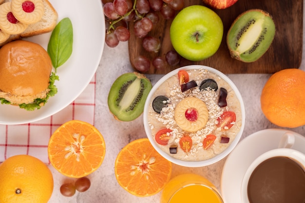 Dessert cup with apples, kiwi, orange, and grapes.