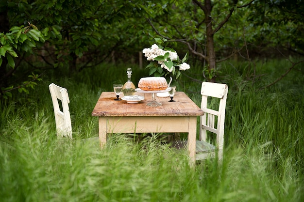 Dessert and flowers on table assortment