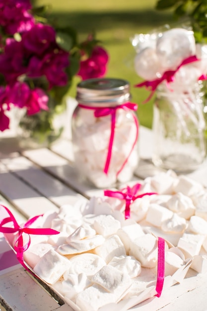 Dessert table for a party Ombre cake cupcakes sweetness and flowers