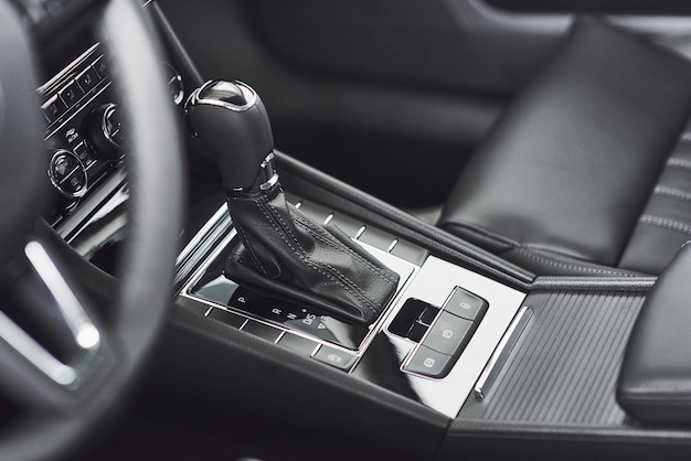 Free photo detail of modern car interior, gear stick, automatic transmission in expensive car.