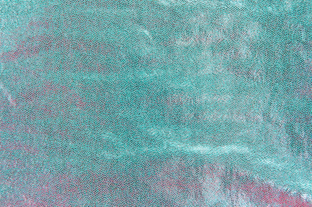 Free photo detail of turquoise sequins in background